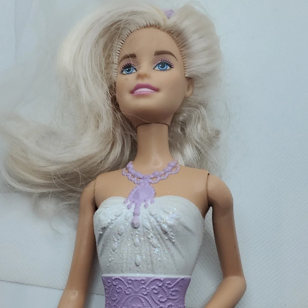 Mattel Dolls with Blonde Hair and Colorful Outfits